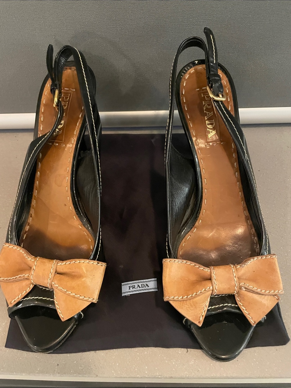 Prada Black Leather Slingback Pumps with Tan Bow Accents